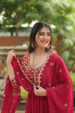 Load image into Gallery viewer, Pure Red Color Faux Blooming Gown With Price and Online Shopping Price Under 1500 . This Fabric Faux Blooming Soft and Round Neck . This Fabric Red Gown Rich Sequins Embroidered work . This Red Color Gown Faux Blooming Fabric Sleeve Puff Sleeve and Dupatta Faux Blooming Fabric and Work Sequins And Embroidered work and Arco-Cut Work . Traditional look For 2024-2025 . 
