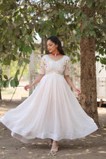 Load image into Gallery viewer, White Faux Blooming Gown With Price and For Online Shopping  Price Under 1500 . this Fabric So Happy and Cool Fabric . this Fabric Faux Blooming Gown Best Famous and Best Popular Gown White Color. White  Gown Round Neck Fully Embroidery Zari Sequins Work .
