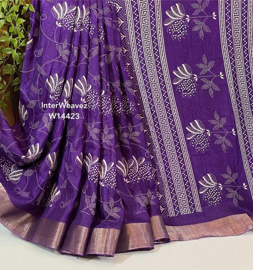 Perfect for weddings, festivals, or parties—this purple silk saree is a must-have! , Crafted from premium Super Dolla cotton silk, this saree promises comfort with class , A timeless purple saree with Leriya design is now just ₹1199—don’t miss out! , Be the center of attention in this graceful purple saree with artistic digital prints , The Viscose Jacquard border adds a rich touch to the already striking purple base .