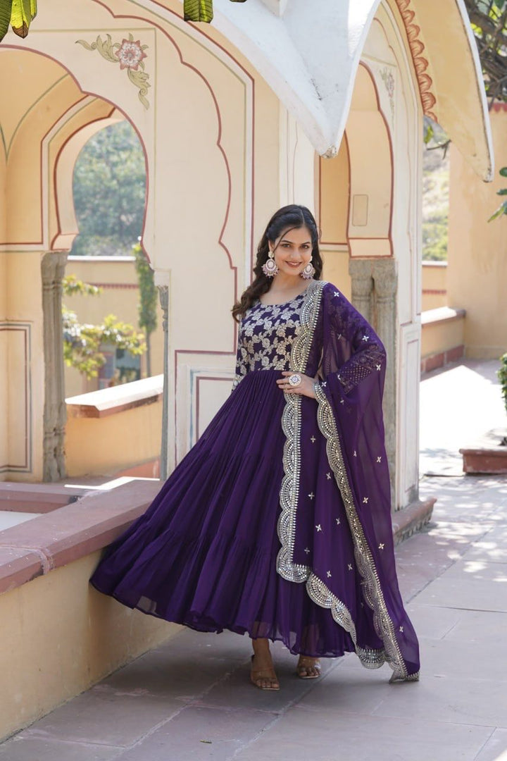 Purple Color Faux Blooming & Viscose Dyable Jacquard Gowns With Price and Online Shopping Price Under 2000 . Step into elegance with this Faux Blooming & Viscose Dyable Jacquard and Dupatta set. Featuring intricate sequins embroidery, a padded design, and four rich shades—Purple color.