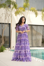 Load image into Gallery viewer, Trendy sky blue gown with subtle floral print , Sky color ethnic gown with designer sleeve style , Full flair sky blue gown with rich printed fabric , Best-selling sky blue gown for wedding guests .

