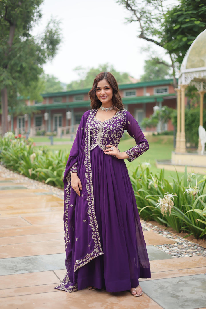 Purple Faux Blooming Anarkali With Price and Online Shopping Price Under 2000 . This Fabric Faux Blooming Purple Grace every occasion with this Fabric Anarkali featuring sequins embroidery, full sleeves, a fancy round neck, and a matching Dupatta Faux Blooming Georgette With Rich Sequins Multi Embroidered Lace Border . Available Purple Color Heavy Sequins Work With Embroidery Work  , Traditional Look For 2024-25 , 2025-26 . 