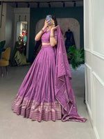 Load image into Gallery viewer, Purple Color Pure Chanderi  Dhavani Set , Langa Voni and Half-Saree With Price and Online Shopping Price Under 2000 . Flaunt elegance with this Pure Chanderi  Plain With Zari Weaving Work Border Lehenga Set. Complete with zari weaving, stitched canvas lehenga, a Pure Chanderi blouse, and a lace-adorned dupatta, this outfit is perfect for festive occasions . 
