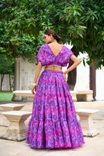 Load image into Gallery viewer, Graceful purple chiffon lehenga with floral prints and pearl detailing , Shop rich purple lehenga set with stitched floral blouse , Designer purple lehenga with heavy flair and soft cotton inner , Purple lehenga for reception, sangeet, or festive functions , Elegant chiffon purple lehenga with romantic floral design - Shop Now at Shoppers Trend
