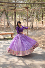 Load image into Gallery viewer, Lavender viscose jacquard lehenga with Kalamkari border , Designer lavender lehenga with zari lace and full sleeves blouse , Full-stitched lavender lehenga with canvas and can-can , Elegant lavender lehenga with dori latkan and zip closure , Lavender wedding lehenga in pure viscose fabric , Stylish lavender lehenga for parties and festivals . 
