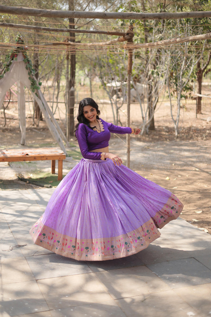 Lavender viscose jacquard lehenga with Kalamkari border , Designer lavender lehenga with zari lace and full sleeves blouse , Full-stitched lavender lehenga with canvas and can-can , Elegant lavender lehenga with dori latkan and zip closure , Lavender wedding lehenga in pure viscose fabric , Stylish lavender lehenga for parties and festivals . 