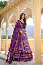 Load image into Gallery viewer, Elegant purple ikkat foil print lehenga in tussar silk , Purple ethnic lehenga choli set with zari border dupatta , Vibrant purple lehenga for weddings and traditional gatherings , Designer purple silk lehenga with festive foil accents . 
