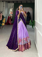 Load image into Gallery viewer, Purple Cotton Silk Dhavani Set , Langa Voni , Half-Saree and Davani 
 Set With Price and Online Shopping Price Under 2000 . Grace any occasion in this exquisite Cotton Silk Embroidered Lehenga. Comes with a stitched lehenga, zari blouse, and sequined georgette dupatta for a timeless and elegant look . 
