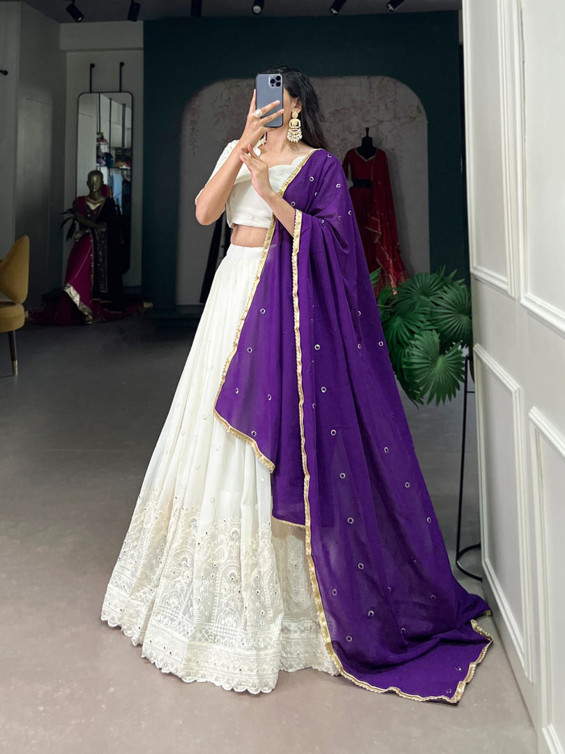 Purple Georgette Dhavani Set, Langa Voni , Half-Saree and Langa Voni With Price and Online Shopping Price Under 3000 . This Fabric Soft and Premium Fabric . This White Georgette Lehenga Lucknowi Paper Mirror Work This Lehenga Working Traditional Look For 2024-25 . This Lehenga Price Under 3000.  