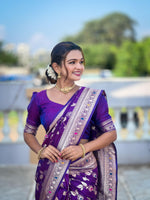 Load image into Gallery viewer, Lavender Banarasi Silk Saree . Made from pure silk, the saree has a smooth, lustrous finish that reflects light, enhancing its richness. The silk used in Banarasi sarees is typically Katan silk, a fine variety of silk that feels luxurious against the skin and drapes beautifully. 
