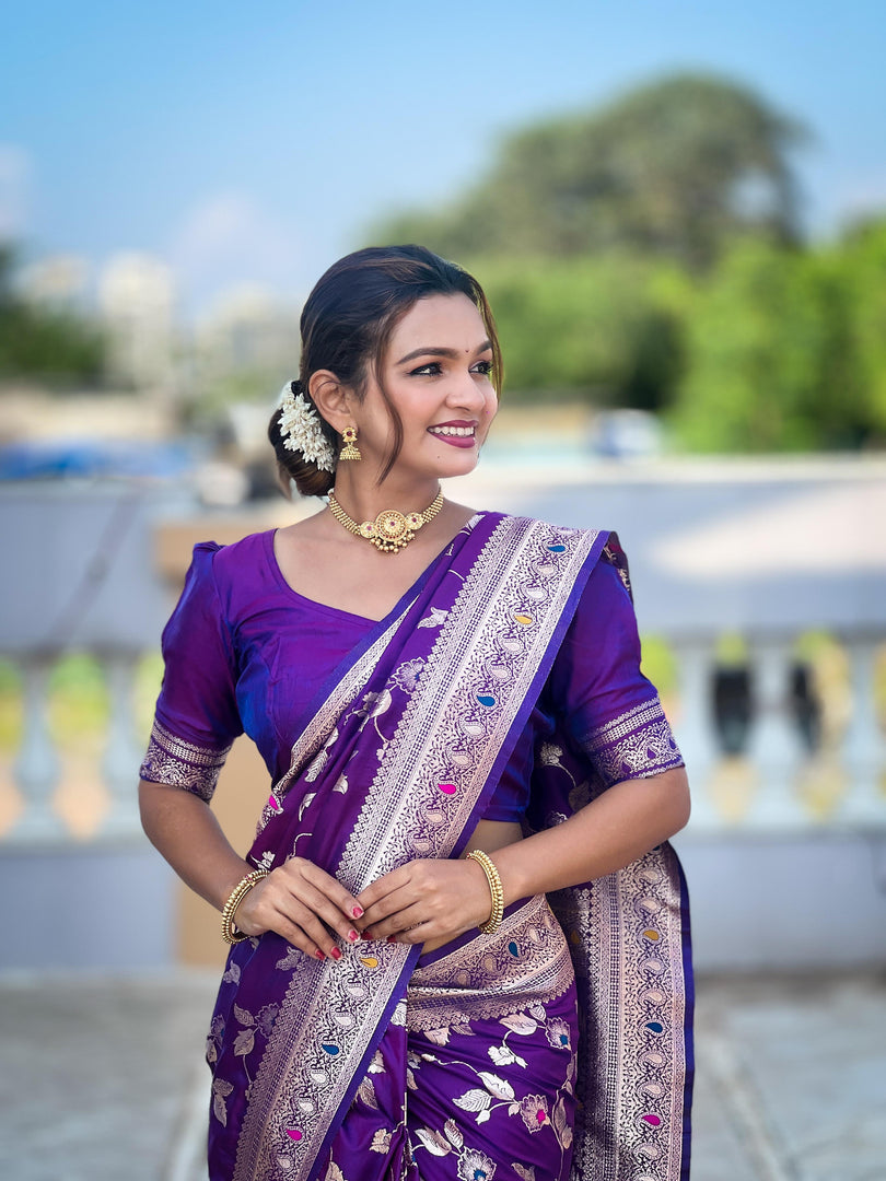 Lavender Banarasi Silk Saree . Made from pure silk, the saree has a smooth, lustrous finish that reflects light, enhancing its richness. The silk used in Banarasi sarees is typically Katan silk, a fine variety of silk that feels luxurious against the skin and drapes beautifully. 
