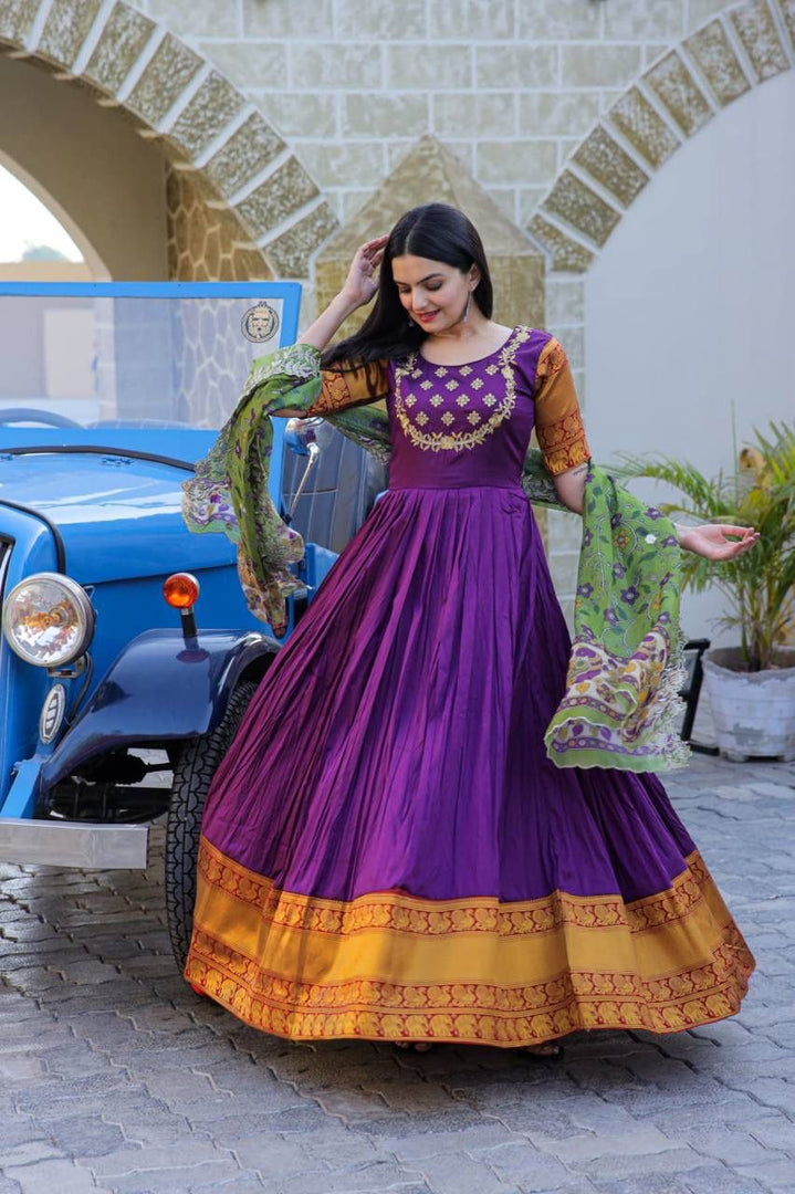Purple Color Silk Fabric Anarkali With Price and Online Shopping Price Under 2000 . This Fabric So Heavy Jacquard Weaving Work and Embroidery Work and Anarkali Bottom Side Heavy Border Zari Weaving Work , Dupatta Tebby Silk With Kalamkari Rich Print with Embroidered Cut Work, This Fabric Purple Anarkali Wedding Wear Best Collection , Traditional Look For 2024-25 , 2025-26 . 
