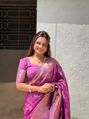 Lavender Soft Banarasi Silk Saree . Made from pure silk, the saree has a smooth, enhancing its richness. The silk used in Soft Banarasi sarees is typically Katan silk, a fine variety of silk that feels luxurious against the skin and drapes beautifully. 