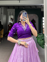 Load image into Gallery viewer, Stitched Tussar Silk Purple Dhavani featuring Bandhej and Patola print with foil work. Includes adjustable lehenga (waist up to 42&quot;, 3.80m flair) with drawstring, tassels and can-can, plus a Pure Cotton blouse with mirror work . Complete set includes lehenga, blouse, drawstring with zip, and tassels.

