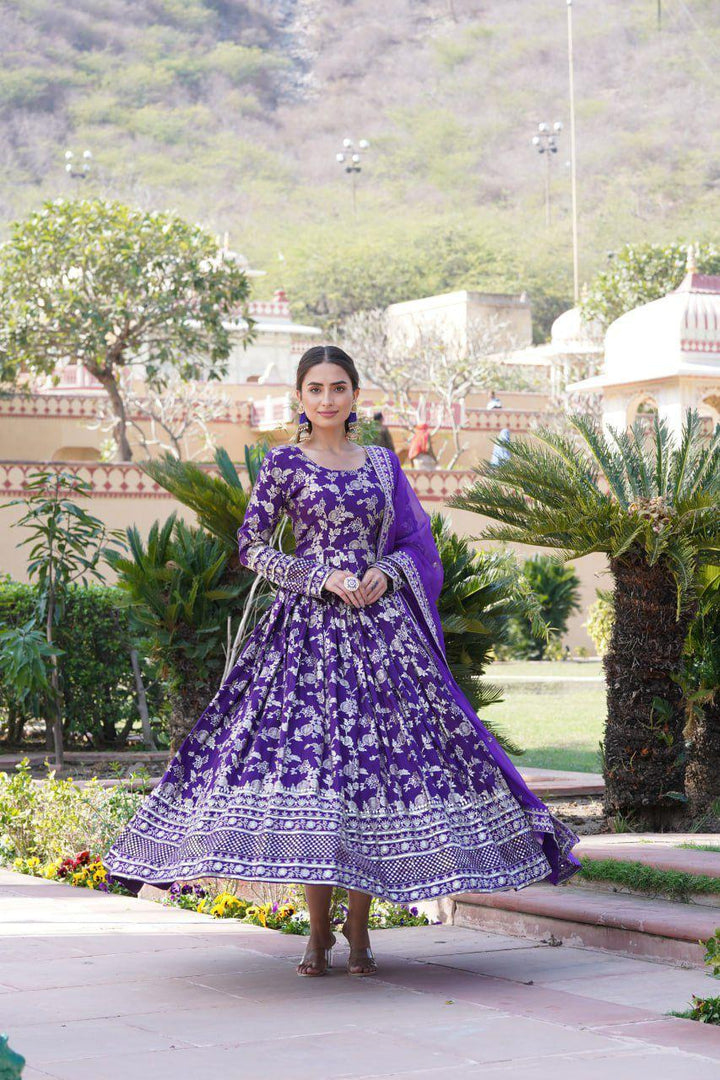 Purple Viscose Dyable Jacquard Gowns With Price and Online Shopping Price Under 2500 . Grace every occasion with this Viscose Dyable Jacquard Gown featuring sequins embroidery, full sleeves, a fancy round neck, and a matching Russian Silk dupatta. This Fabric Purple Color Traditional Look 2024-25 . 