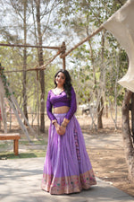 Load image into Gallery viewer, Lavender ethnic lehenga with cotton inner comfort , Traditional lavender lehenga with Jari Kalamkari design , Lavender lehenga with phantom blouse and V-neck design . 
