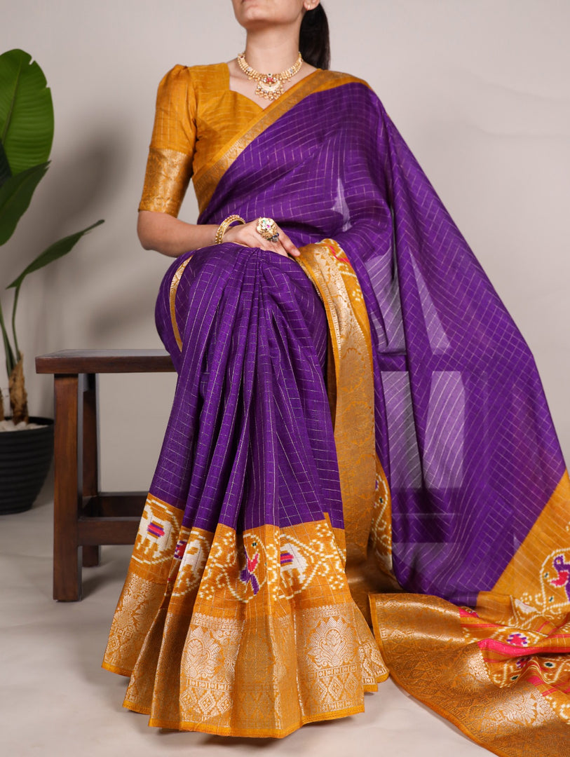 Purple With Orange Color Tussar Checks Sarees With Price and Online Shopping Price Under 1000 . this Fabric Soft and Tussar Checks and Rich Orange Premium Border and Patola Print With Weaving Work Border adn Blouse Zari Weaving Work . Traditional Look 2024-25 . 