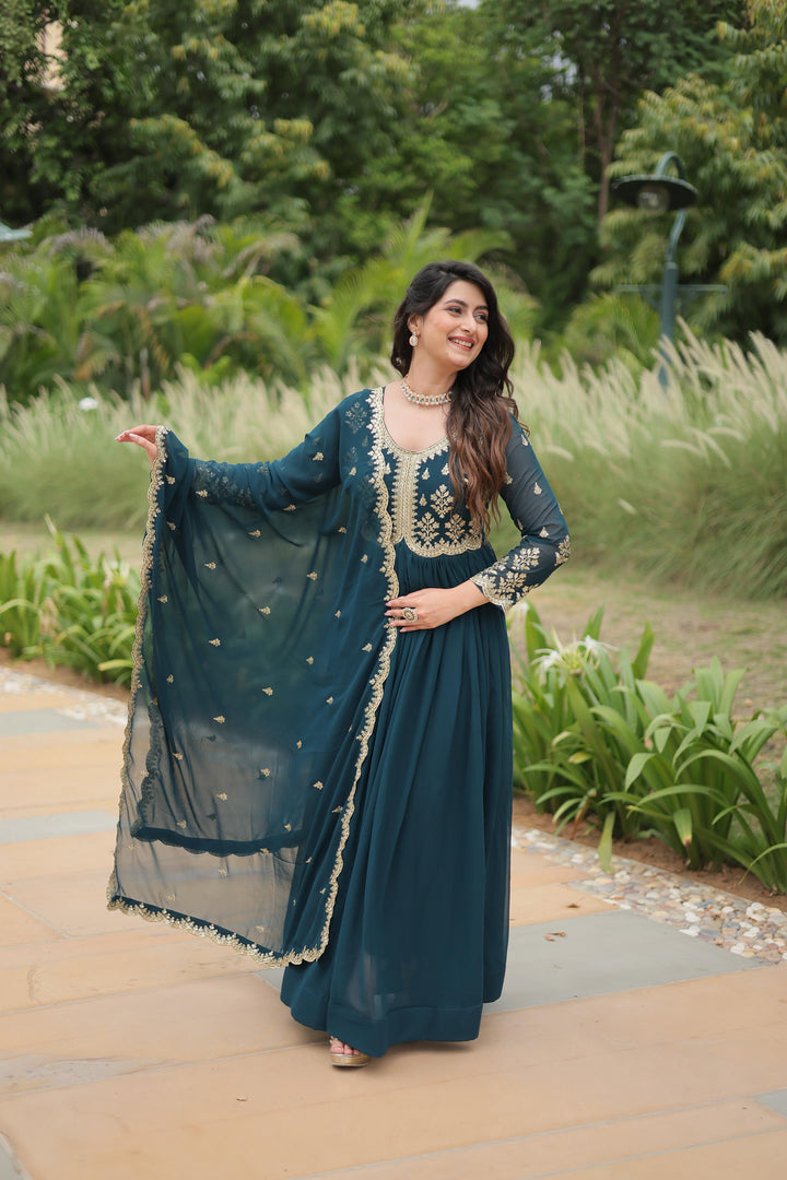Dark Sky Or Rama Color Faux Blooming Gowns With Price and Online Shopping Price Under 1500 . this fabric Sequins-Multi & Zari Embroidered Work ,Explore elegance with this standard-stitched gown. Sequins and zari embroidery, cotton lining, and a 2.3-meter embroidered lace dupatta included.
