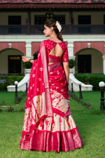Load image into Gallery viewer, Shop elegant Rani Pink Dola Silk Lehenga with Bandhej Print Blouse , 
Rani Pink Shibori Lehenga with Zari Border – Perfect for festive wear , 
Traditional Rani Pink Lehenga in premium Dola Silk , Designer Rani Pink Lehenga with tassel dupatta . 

