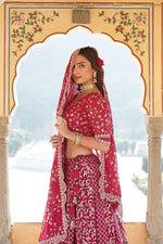 Load image into Gallery viewer, Divisha Half Saree Set includes a full-stitched lehenga made of pure viscose jacquard with embroidered sequins and a chain with dori latkan closure. The unstitched blouse is made from faux blooming fabric with sequined embroidery. 
