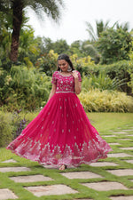 Load image into Gallery viewer, Party wear rani gown with 3.5 mtr flair , Rani embroidered gown for wedding and festive wear , Designer rani color gown in faux blooming fabric , Traditional rani gown with full inner cotton lining . 
