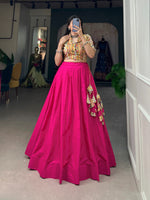 Load image into Gallery viewer, Cotton lehenga with handmade tassels , Plain lehenga with printed blouse , Rani pink stitched lehenga choli , Breathable cotton lehenga for summer , Festive lehenga in yellow and rani .  
