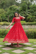 Load image into Gallery viewer, Red Color Faux Blooming Gown With Price and Best Wedding Collection Price Under 1500 .this Fabric Grace your events with this stunning Faux Blooming Gown. Highlighting intricate zari-sequins embroidery, a square neck, and a 3.5-meter flair, it offers unmatched style and comfort 

