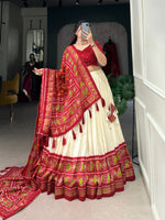 Load image into Gallery viewer, Festive Red Tussar Silk Lehenga with Patola Print Dupatta , Buy Red Lehenga for wedding ceremonies and festive occasions , Designer Red Lehenga with tassels and zip closure , Elegant Red color Lehenga with Patola Print Blouse , Traditional Red Lehenga with Gotta Patti Lace Border , Red Tussar Silk Lehenga with heavy flair and canvas stitching.
