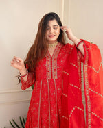 Load image into Gallery viewer, Stylish 3-piece suit set with hand embroidery, zari weaving, and a full lace organza dupatta. Includes a kurti and matching pants in heavy mill rayon foil print fabric. Featuring a heavy suit set in rayon mill foil print with intricate embroidery and zari work. Paired with matching pants and an embroidered organza dupatta. Colors: Red &amp; Maroon.
