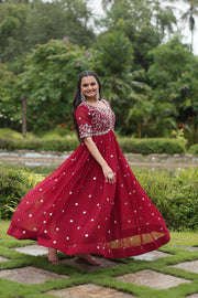 Stylish faux red gown for bridal functions , Red party wear gown with sequin highlights , Premium red gown for engagement and receptions , Soft faux fabric gown in bright red shade , Traditional red gown for Wedding , party , festival and pooja . 