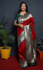 Load image into Gallery viewer, Red Colour Pure Soft Silk Sarees price and online shopping price under 2500 . this Fabric smooth softness red color with silver Zari Weaving border and blouse Green colour most famous and best product .
