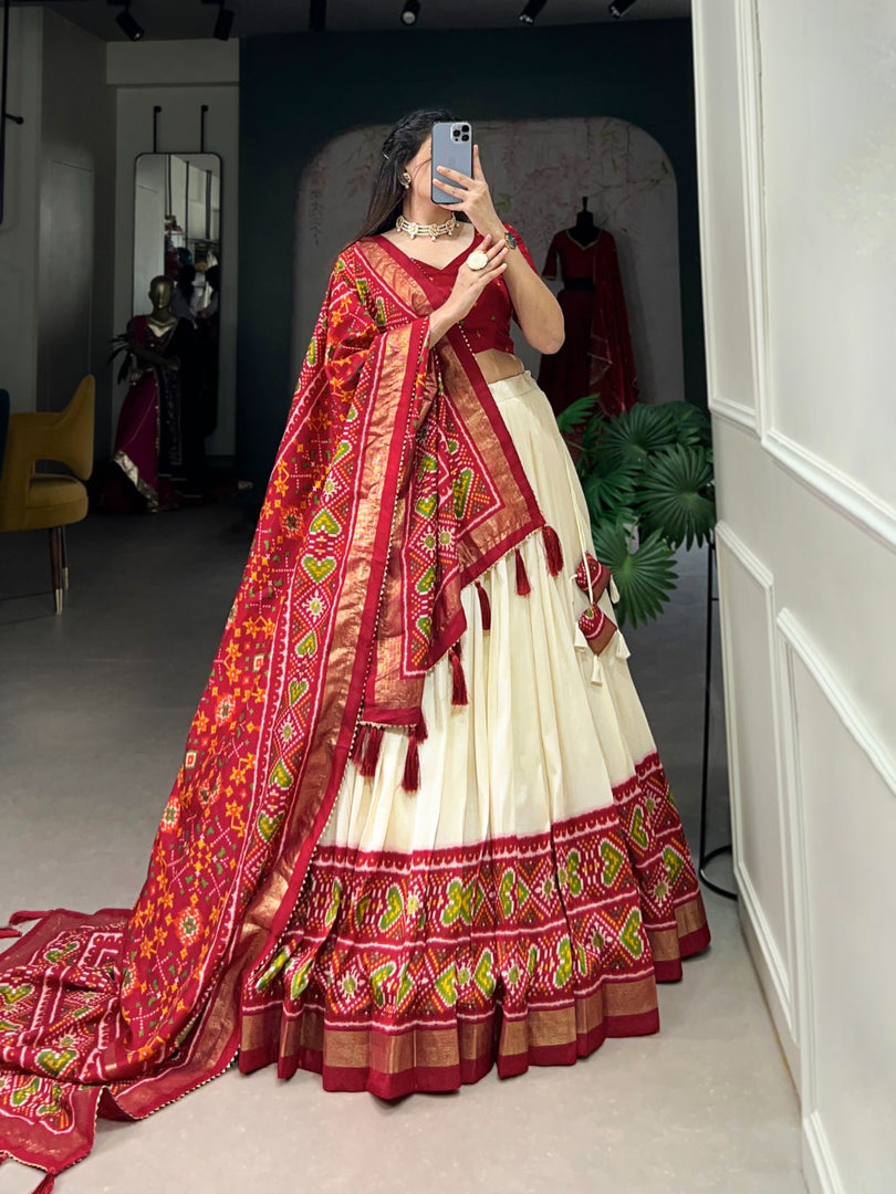 Red Tussar Silk Dhavani Set , Half-Saree , Davani Set and Langa Voni With Price and Online Shopping Price Under  2000 . This Fabric Patola Printed Work and This Fabric Soft and Smooth Fabric . This Fabric Red and Cream Combination Color FIne and Dupatta Jumka Latkan Cream Lehenga  Red Blouse Traditional Look For 2024-25 . 