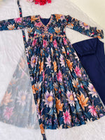 Load image into Gallery viewer, Elegant blue Anarkali with V-neck and ethnic flair , Blue cotton Anarkali with soft butter crape pant , Traditional blue Anarkali suit with modern touch , Soft blue Anarkali dress for women with dupatta , Blue Anarkali set with handcrafted mirror detailing , Blue partywear Anarkali with printed lace dupatta .
