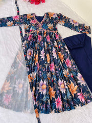 Elegant blue Anarkali with V-neck and ethnic flair , Blue cotton Anarkali with soft butter crape pant , Traditional blue Anarkali suit with modern touch , Soft blue Anarkali dress for women with dupatta , Blue Anarkali set with handcrafted mirror detailing , Blue partywear Anarkali with printed lace dupatta .