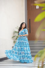 Load image into Gallery viewer, Gorgeous sky faux georgette gown for mehendi function , Sky blue flared gown with soft print , Designer sky color gown for festivals and events . 
