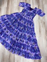 Load image into Gallery viewer, Trendy sky blue gown with subtle floral print , Sky color ethnic gown with designer sleeve style , Full flair sky blue gown with rich printed fabric , Best-selling sky blue gown for wedding guests , Comfortable sky gown with half sleeves and lining . 
