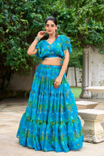 Load image into Gallery viewer, Fully stitched blue lehenga with drawstring and zip closure , Blue printed lehenga with elegant pearl blouse combo , Floral magic in a soft blue lehenga for every occasion , Stylish and traditional blue lehenga outfit online , Blue chiffon lehenga – a perfect blend of style and comfort.
