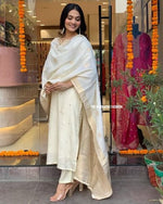 Load image into Gallery viewer, White Color Heavy Banana Chanderi Silk Kurti Price and Best Mahoram and Eid , Ramzan Price Under 2000 . this Heavy Banana Chanderi Silk Kurti Set in Size S. Adorned with intricate zari weaving, it comes complete with a graceful dupatta and a stylish pant. Ideal for festive celebrations, this set offers elegance and comfort, all with the convenience of machine wash care.
