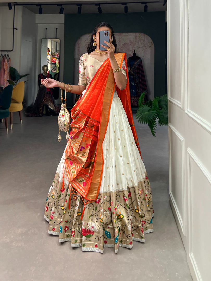 White Color Jacquard Silk ( Paithani ) Dhavani Set , Langa Voni , Half-Saree and Davani Set With Price and Online Shopping Price Under 3000 . This Fabric So Heavy and Zari Weaving Work , Traditional Look 2024-25 , 2025-26 . Elevate your ethnic style with this exquisite Jacquard Silk Paithani Lehenga Set. Featuring Zari Weaving Work, a flair of 3.5 meters, and a matching Dupatta with tassels, it comes with a Batwa and a beautifully stitched lehenga supported up to a 42" waist. Perfect for special occasions .