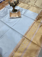 Load image into Gallery viewer, Pure white lichi silk saree with subtle jacquard work , Elegant white silk saree for puja, temple and rituals , Classic white soft silk saree with golden jacquard , Trendy white lichi saree for minimalist style lovers , Soft silk saree in white for a graceful ethnic touch , White saree with jacquard border – ideal for summer functions . 

