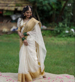 Load image into Gallery viewer, Soft organza Onam saree featuring elegant checks with zari border. 6.3 meters in length with puff half sleeves. Machine washable. Package includes one gown.
