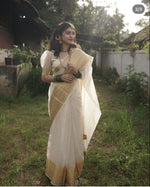 Load image into Gallery viewer, 6.3M soft organza Onam Saree with check pattern and zari border. Features puff half sleeves. Machine washable. Includes one gown piece.
