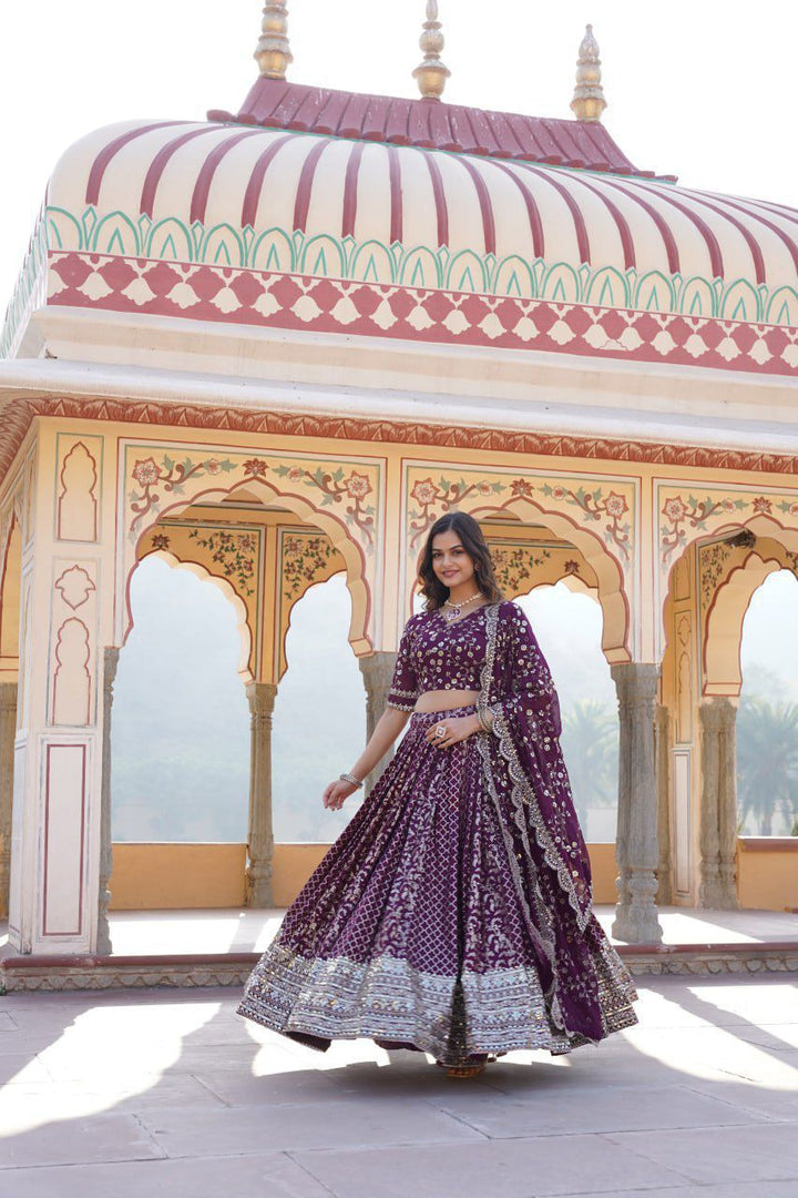 Wine lehenga set with embroidered blouse and net dupatta , Trending Wine lehenga for bridal and festive collections , Party-perfect Wine lehenga with a flattering silhouette , Gorgeous Wine color lehenga in rich viscose fabric , Celebrate in style with this Wine wedding lehenga , Shop Wine embroidered lehenga for modern ethnic wear.