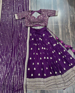 Load image into Gallery viewer, Dark Purple Faux Blooming Lehenga with rich sequin embroidery , Look royal in a Dark Purple lehenga choli featuring thread and zari embroidered details , Be festive-ready with our Dark Purple heavy embroidered lehenga, perfect for weddings . 
