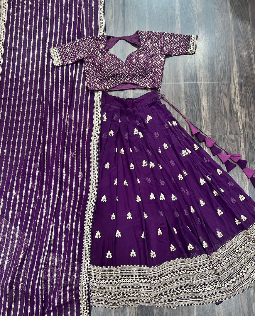Dark Purple Faux Blooming Lehenga with rich sequin embroidery , Look royal in a Dark Purple lehenga choli featuring thread and zari embroidered details , Be festive-ready with our Dark Purple heavy embroidered lehenga, perfect for weddings . 
