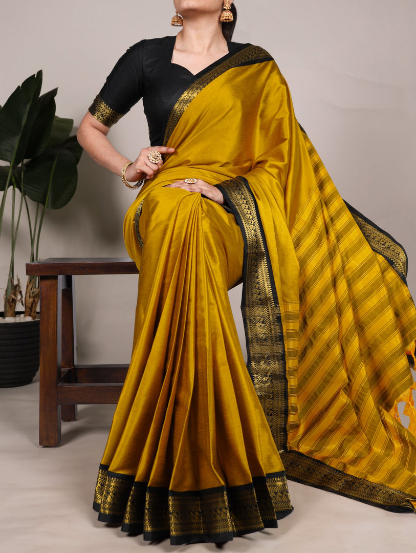 Sunshine yellow silk saree in aura fabric , Yellow zari weaving saree for haldi and functions , Bright yellow aura silk saree with classic border , Festive wear yellow silk saree with zari detailing , Yellow saree with matching blouse piece included . 