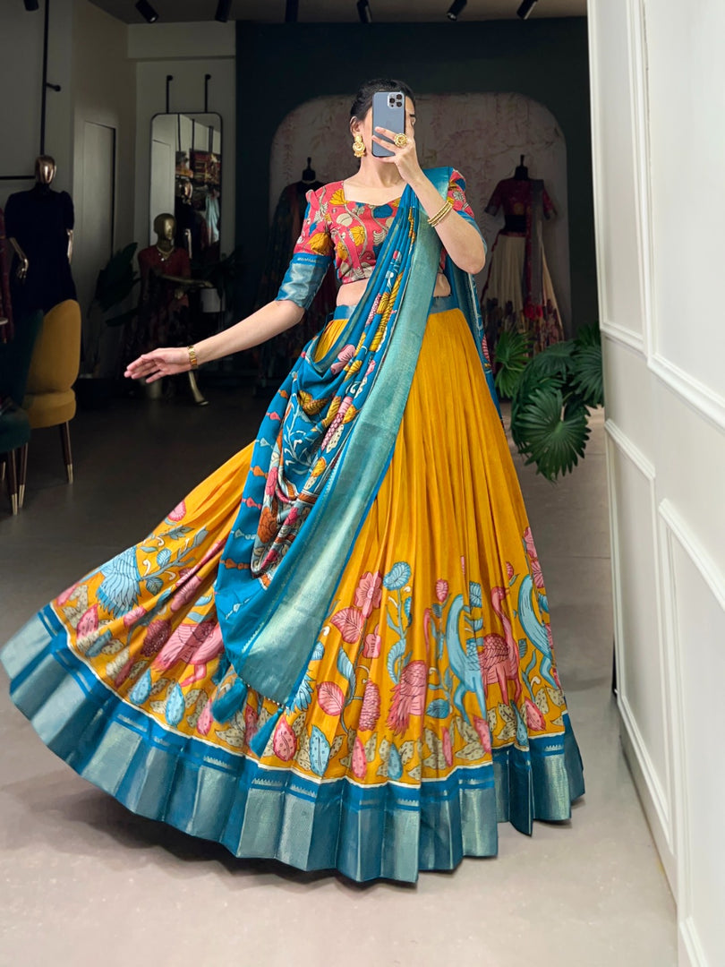 Yellow and Blue Color Dola Silk Langa Voni , Davani Set , Half-Saree and Dhavani Sets With Price and Online Shopping Price Under 2000. Make a statement with this Kalamkari Lehenga crafted in Dola Silk. Includes a flared lehenga, printed blouse, and a zari-bordered dupatta with tassels. Perfect for weddings and festive celebrations . Traditional Look 2024-25 . 