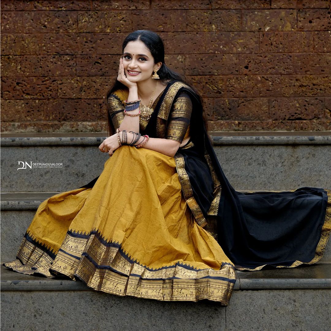 Expertly crafted with high-quality materials, this Premam Dhavani Set features a beautiful Fully Stitched Cotton Lichi lehenga with a large Jacquard design, accompanied by a Canvas and Zip Fabric Blouse.