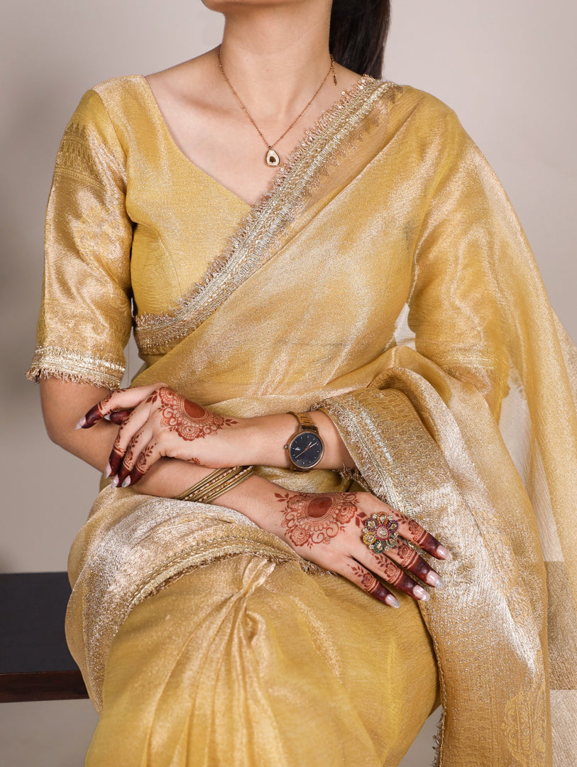 Yellow Tissue Shimmer Sarees With Price and Online Shopping Price Under 1500 . this Fabric For Wedding Best Price Under 1500 . This stunning Tissue Shimmer saree is adorned with intricate zari weaving and a shimmering sequins lace border, offering a perfect blend of tradition and elegance. Paired with an equally exquisite blouse, this outfit is ideal for weddings, festive celebrations, and formal gatherings.