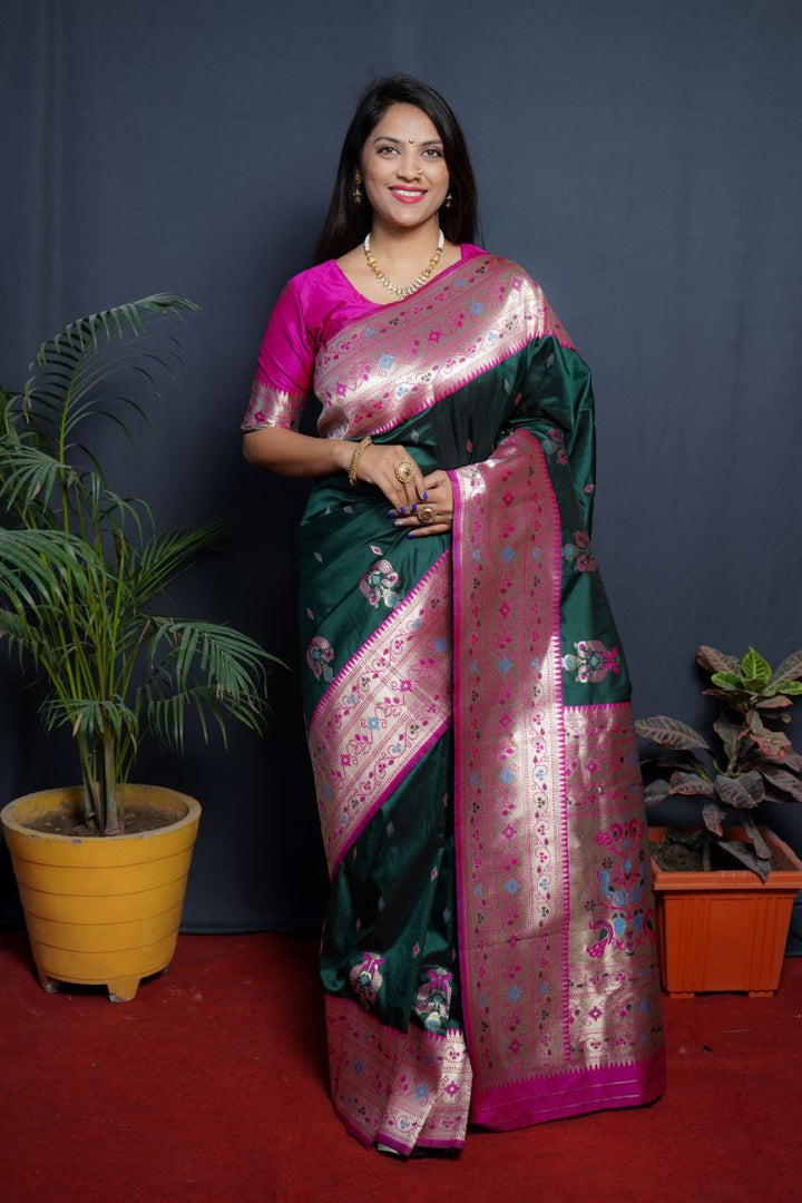 Dark green color Pure soft silk saree with silver zari weaving work . This dark green and silver combination designer soft silk saree  price under 2500 . 